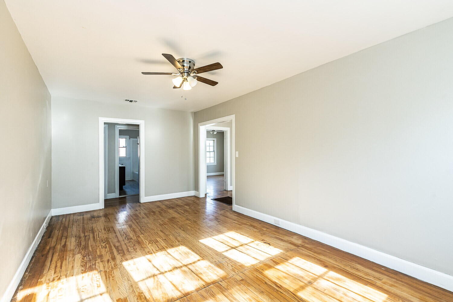 1914 25th Street Lubbock, TX 79411 - Photo 20 of 48 a view of empty room with wooden floor and fan