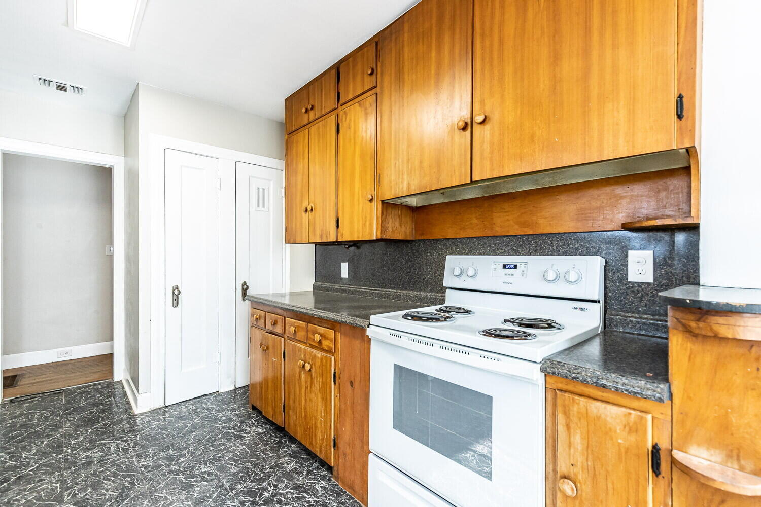 1914 25th Street Lubbock, TX 79411 - Photo 24 of 48 a kitchen with stainless steel appliances granite countertop a stove a sink and a microwave