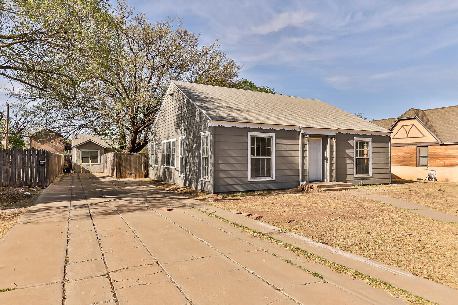 1914 25th Street Lubbock, TX 79411 - Photo 3 of 48 a front view of a house with a garden