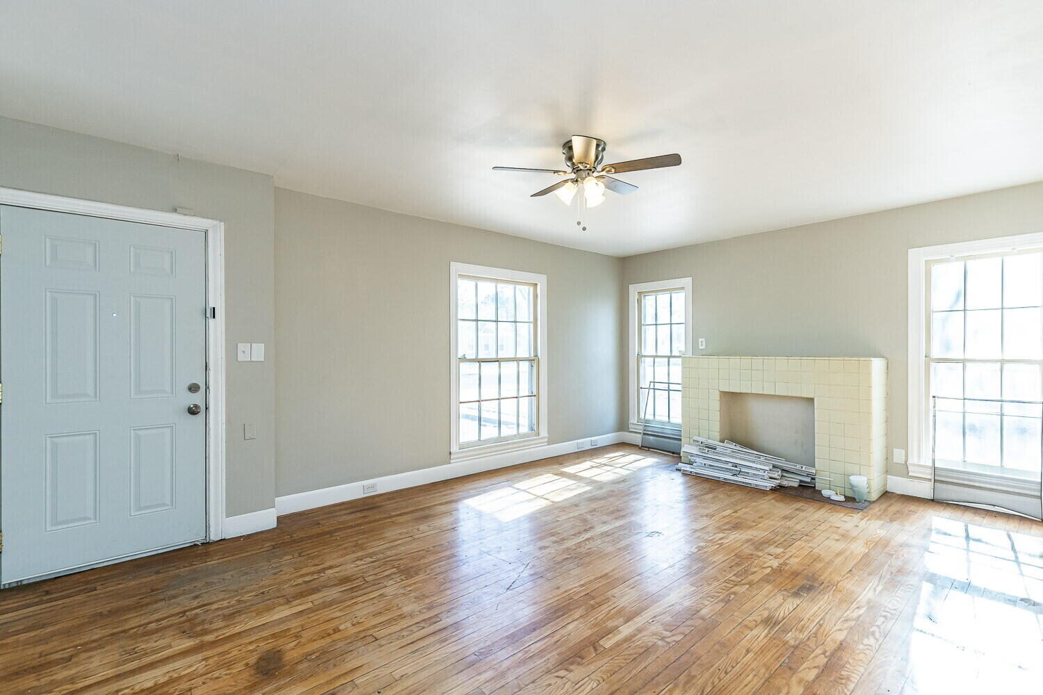 1914 25th Street Lubbock, TX 79411 - Photo 9 of 48 a view of empty room with wooden floor and fan