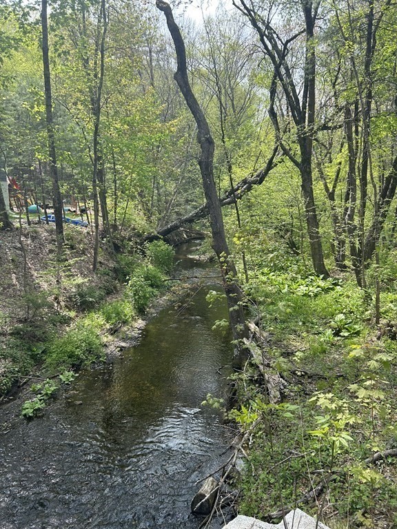 0 Parker Road Lancaster, MA 01523 - Photo 5 of 5 a backyard of a house with lots of green space
