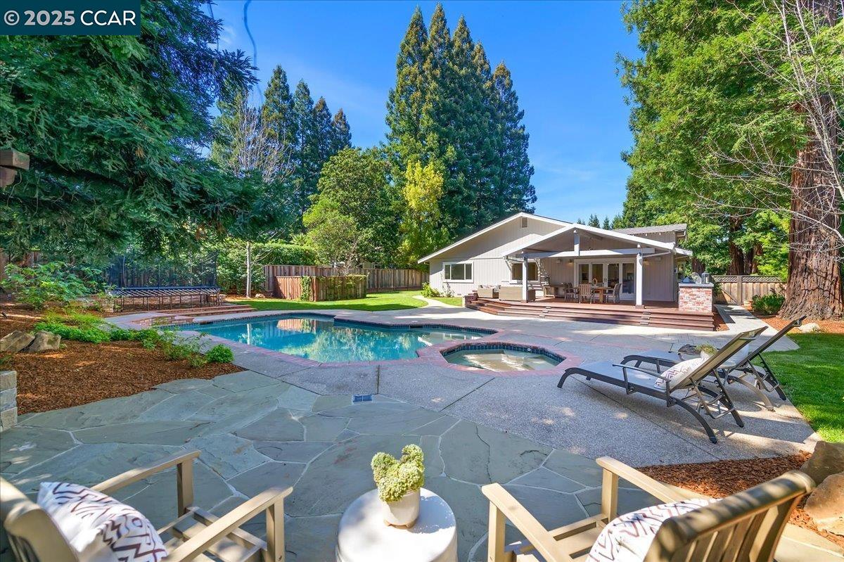an aerial view of a house with swimming pool