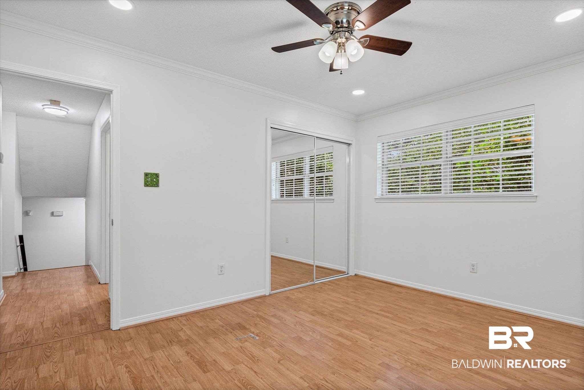 8301 Fordham Road Mobile, AL 36619 - Photo 19 of 57 Bright room featuring wood-finish flooring, a ceiling fan with integrated lighting, recessed lighting, and a window with blinds