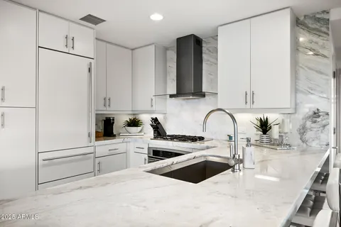 a view of a livingroom with workspace and a window