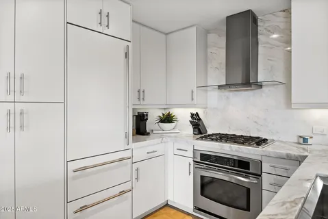 a view of a living room with a floor to ceiling window and floor to ceiling window