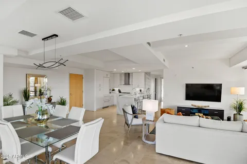 a bedroom with a large bed and a large window