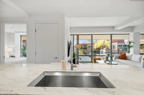 a bedroom with a large bed and a large window