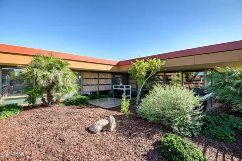 a view of swimming pool with a patio