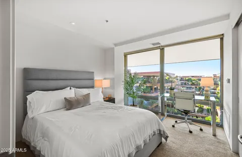 a view of a park with plants and bench