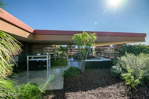 a outdoor living space with patio furniture and a potted plants