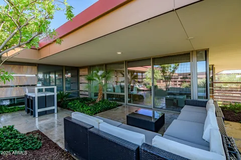 a view of a patio filled with furniture