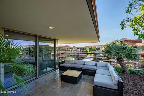 a room with kitchen island a sink a counter top space and appliances