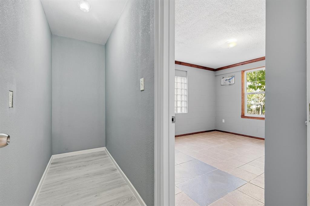 3604 Waters Street Lancaster, TX 75134 - Photo 13 of 15 a view of an empty room with window and stairs