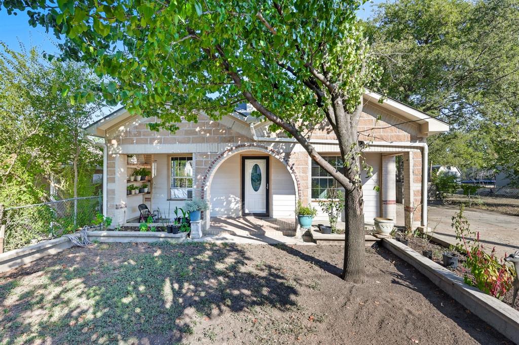 3604 Waters Street Lancaster, TX 75134 - Photo 2 of 15 a front view of a house with garden