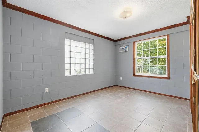 a view of an empty room with a window