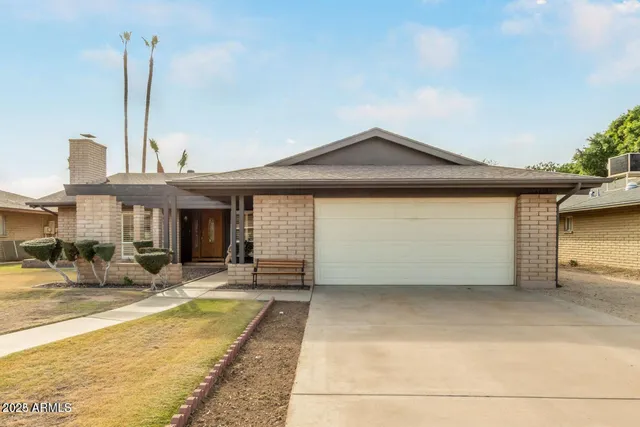 a swimming pool with outdoor seating and yard