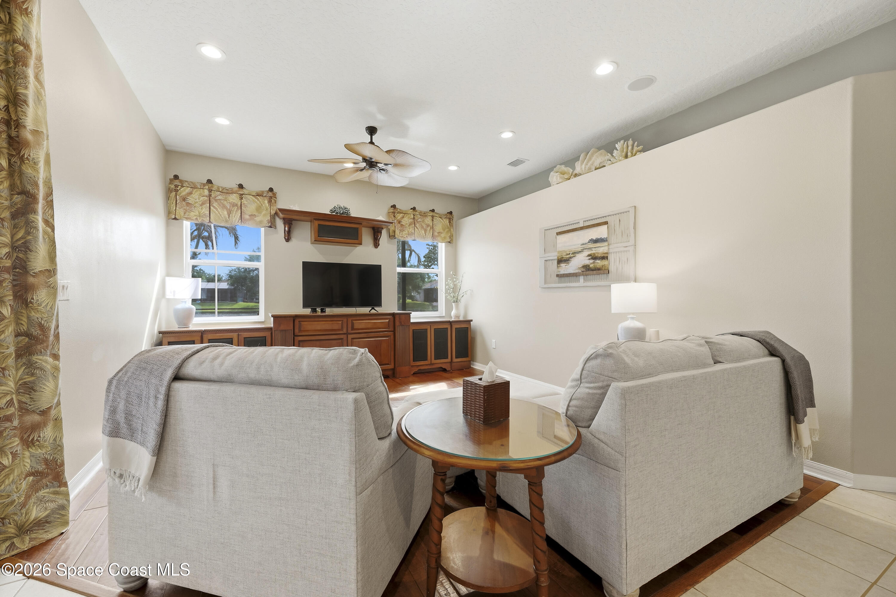 1643 Long Pine Road Melbourne, FL 32940 - Photo 13 of 63 a living room with furniture and a flat screen tv