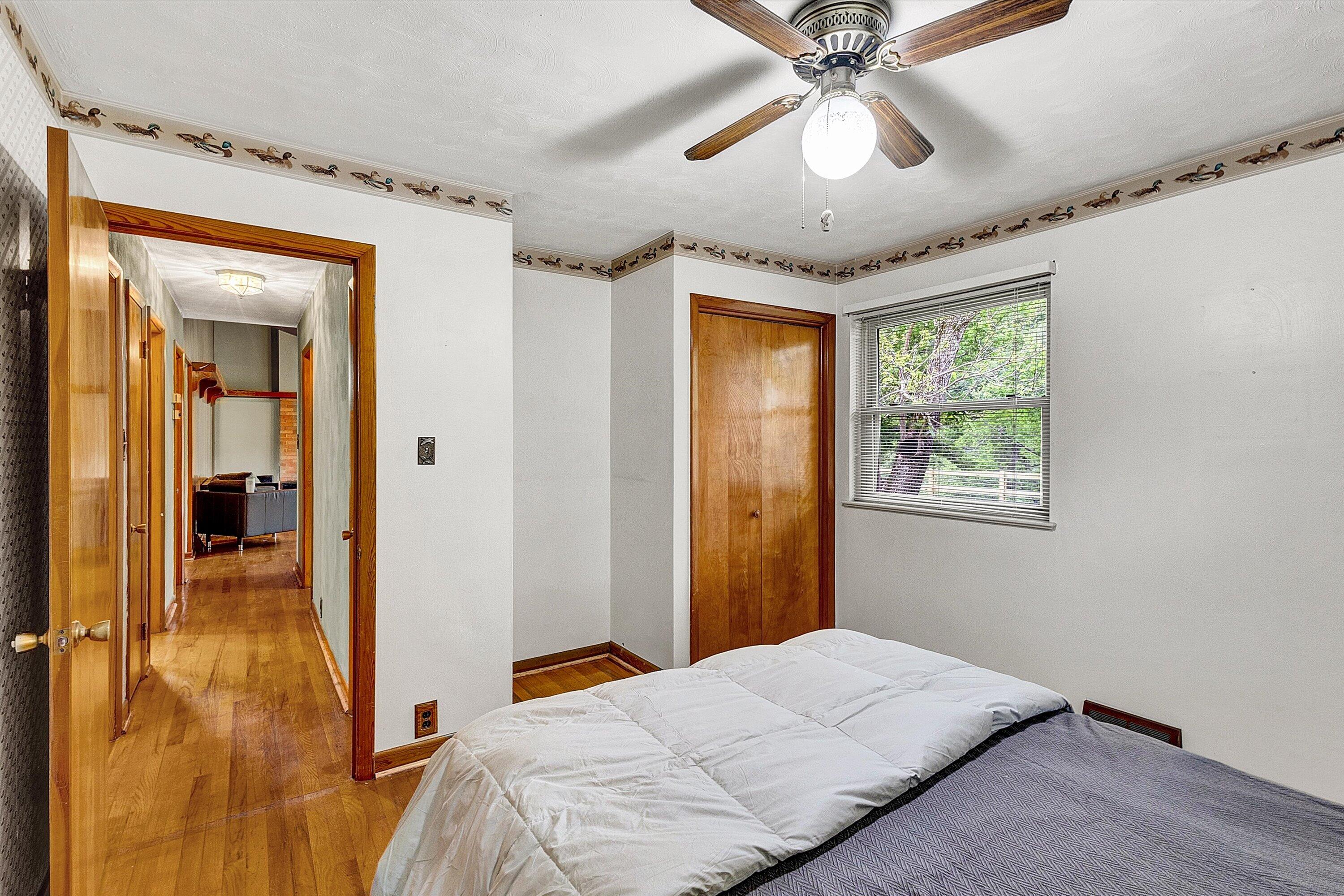 2015 Evergreen Road Covington, VA 24426 - Photo 19 of 46 a bedroom with a bed and a chandelier