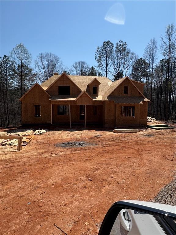 5119 Yellow Creek Road Ball Ground, GA 30107 - Photo 2 of 48 a front view of a house with a yard