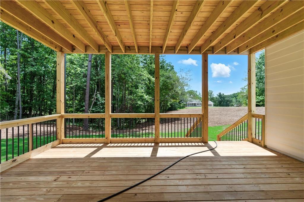 5119 Yellow Creek Road Ball Ground, GA 30107 - Photo 42 of 48 a view of a balcony with wooden floor