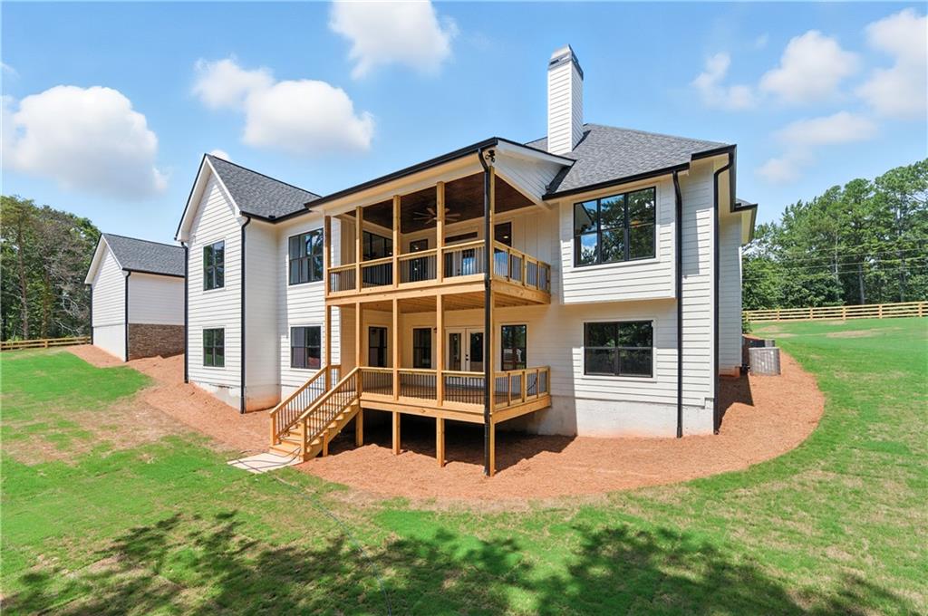 5119 Yellow Creek Road Ball Ground, GA 30107 - Photo 43 of 48 a front view of a house with a yard