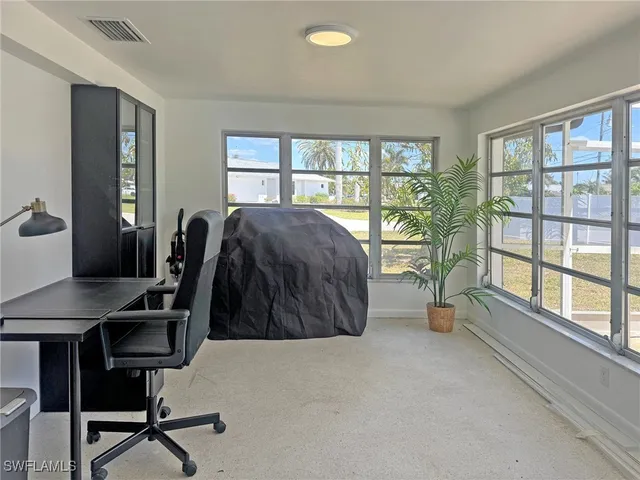 a view of a room that has a window