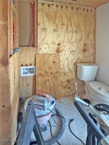 a view of an house with backyard and sitting area