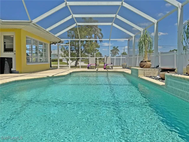 a view of a chairs and table in the patio