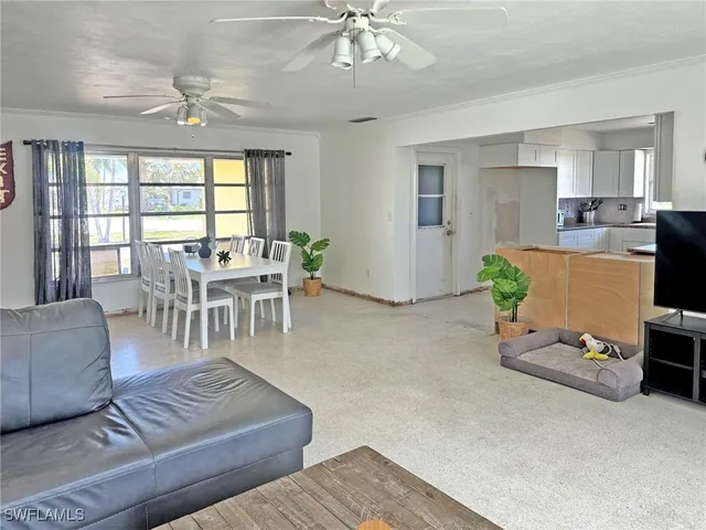a living room with furniture and a table