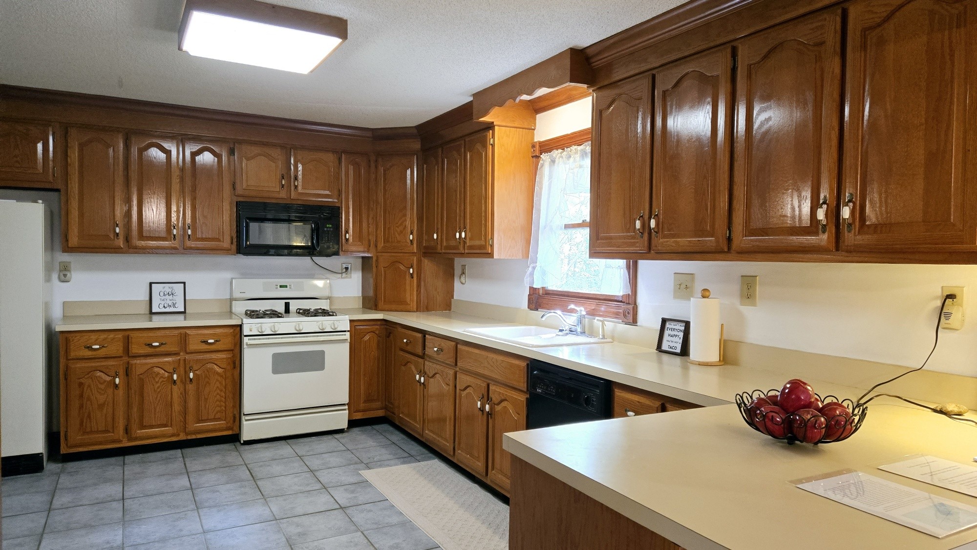 95 Ratteree Road Buchanan, TN 38222 - Photo 11 of 33 a kitchen with stainless steel appliances a stove sink microwave and cabinets