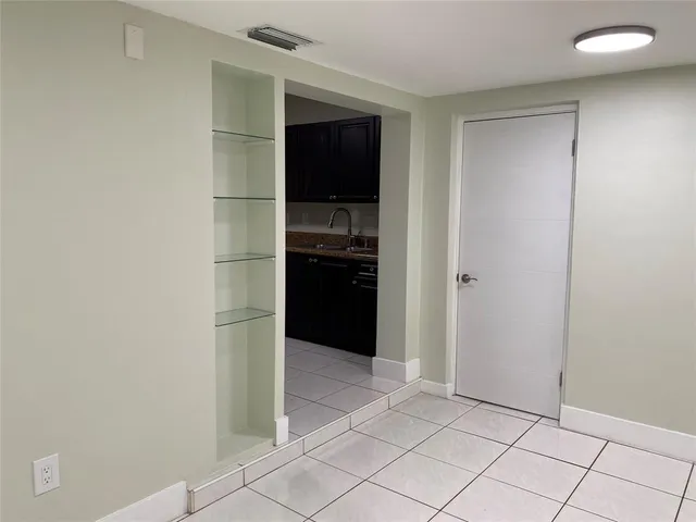 a view of kitchen space with cabinets