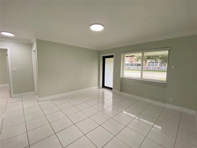 a view of an empty room and window