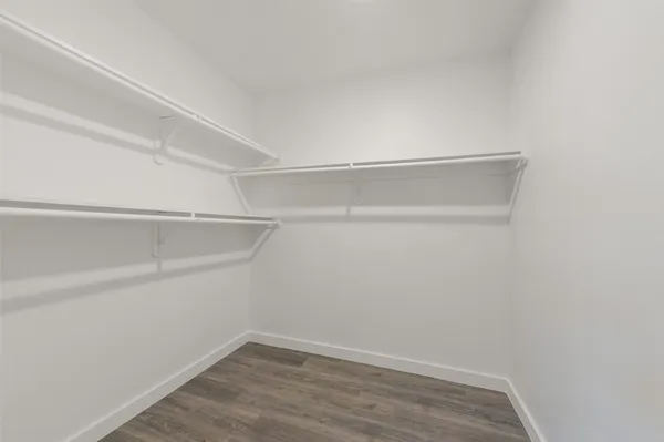 a view of an empty walk in closet