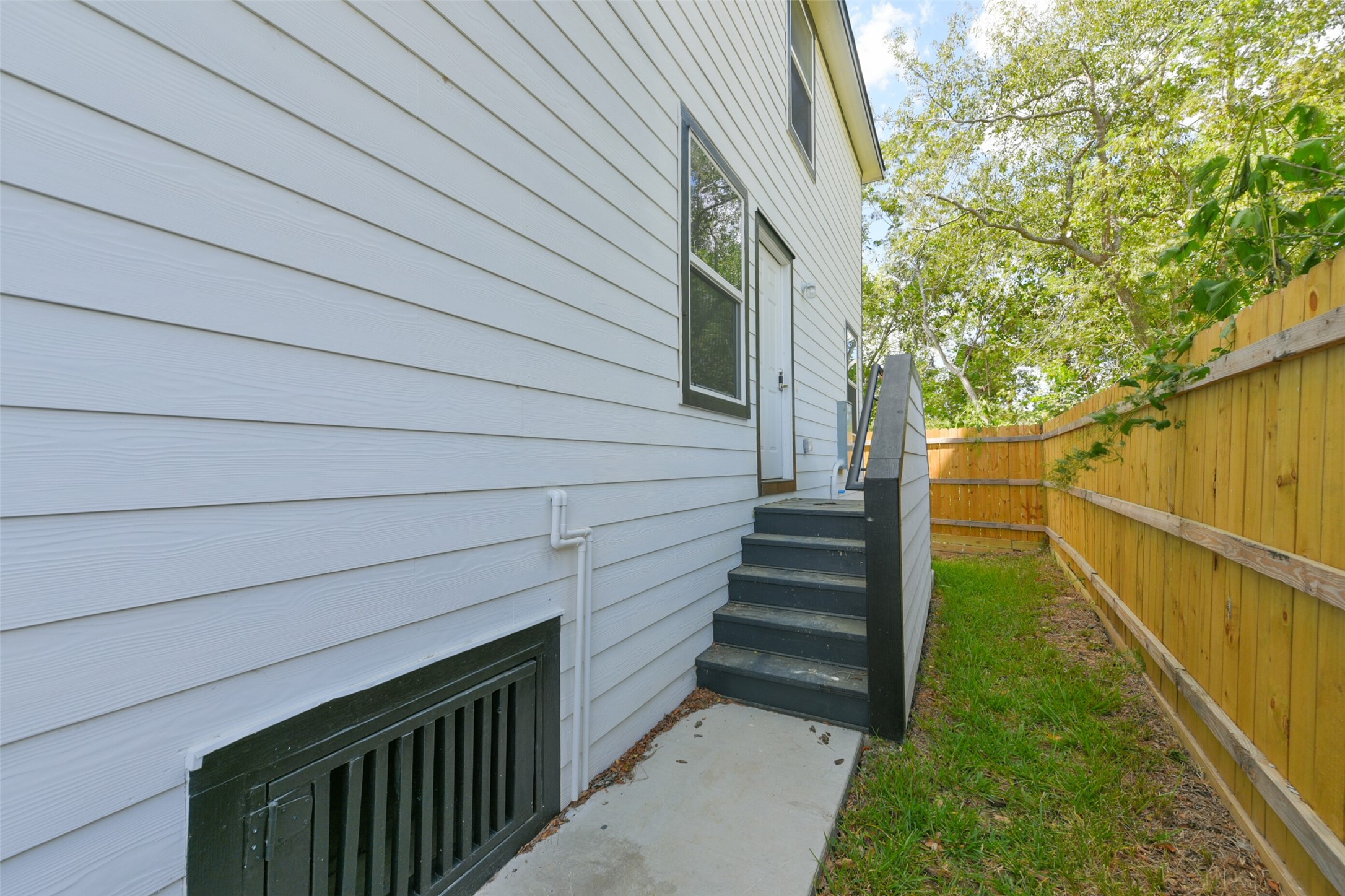 8713 Southwark Street, Unit B Houston, TX 77028 - Photo 15 of 17 a view of entryway with wooden floor