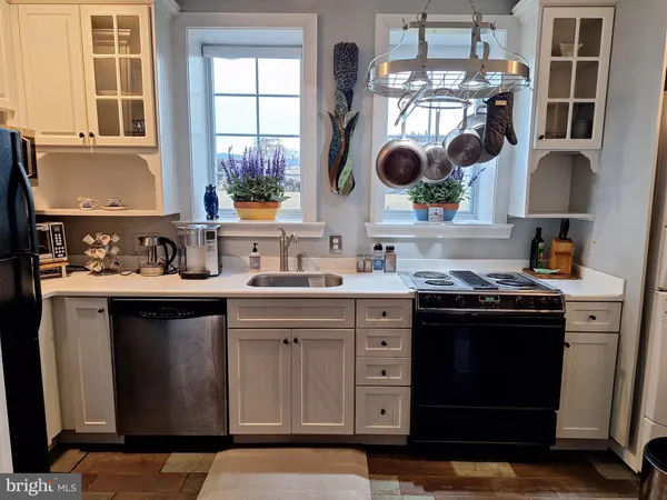 a kitchen with a sink and a stove