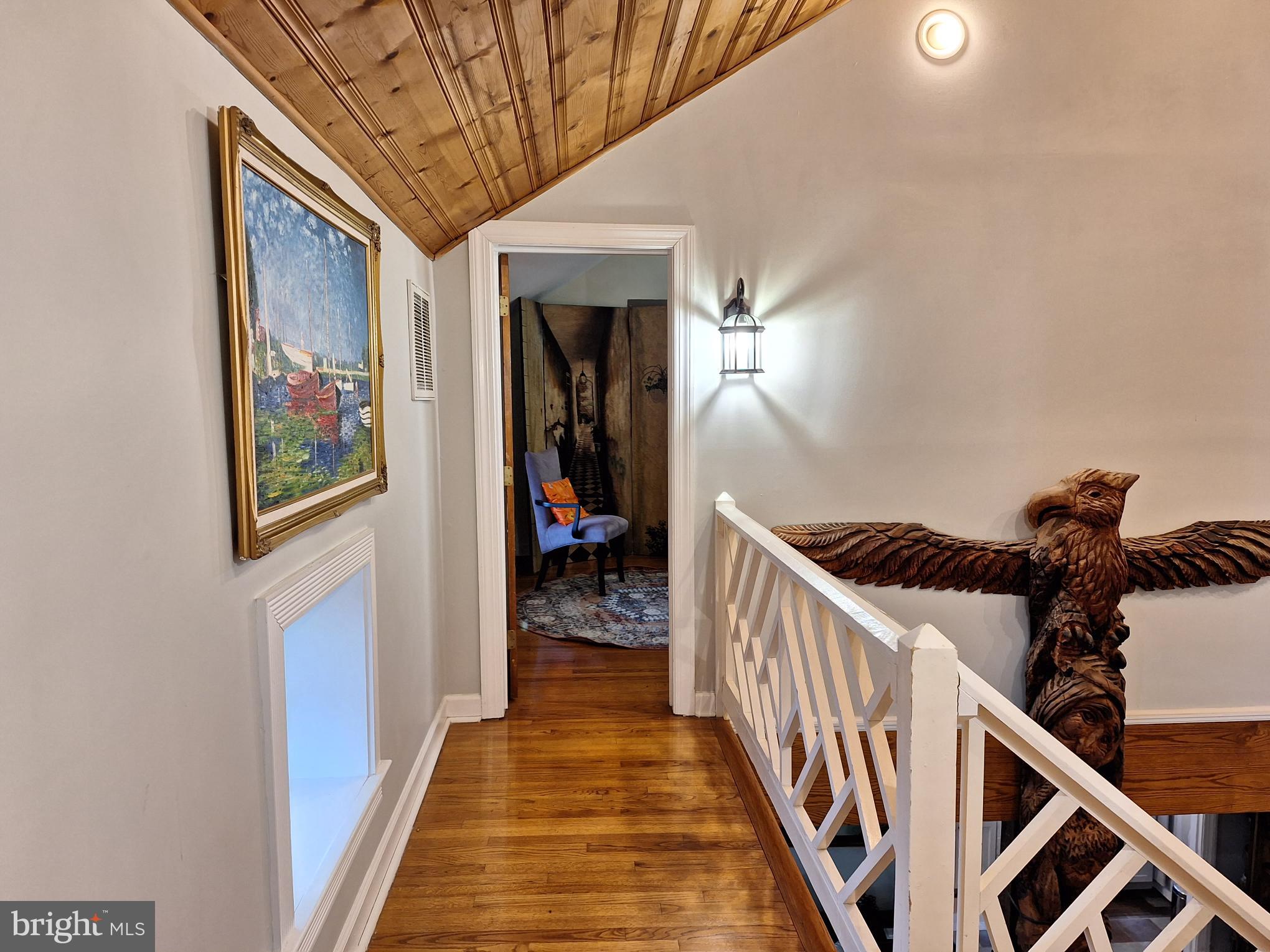 2254 Winchester Road Delaplane, VA 20144 - Photo 22 of 50 a view of a hallway with wooden floor and staircase