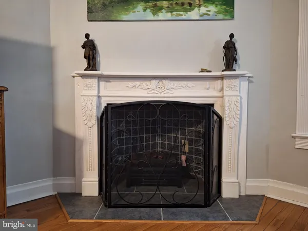 a view of fireplace and wooden floor