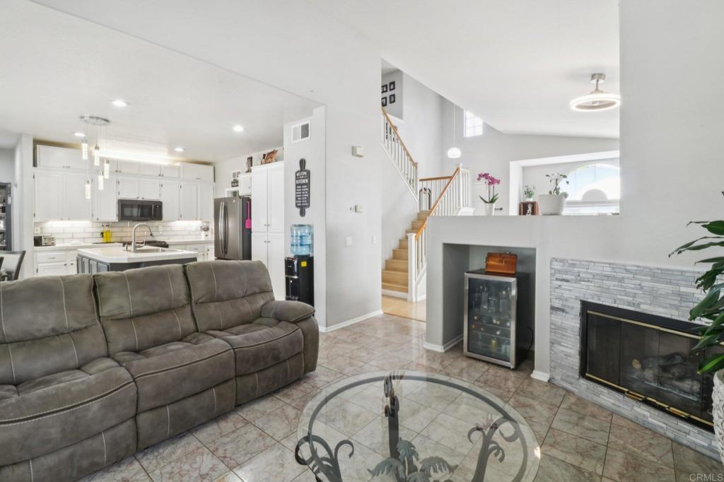 232 Manzanilla Way Oceanside, CA 92057 - Photo 11 of 35 a living room with furniture and a fireplace