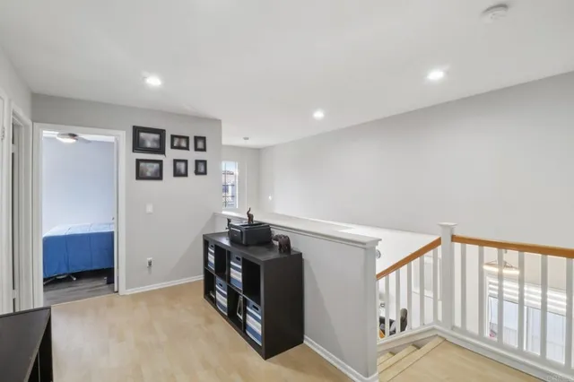 a view of hallway with stairs and a couch