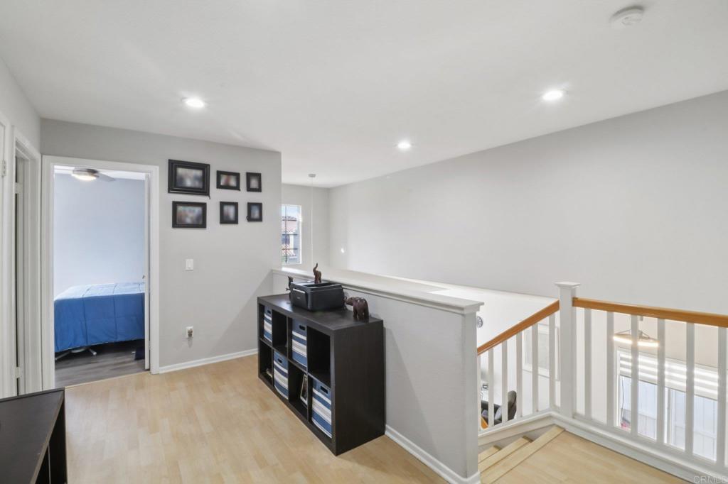 232 Manzanilla Way Oceanside, CA 92057 - Photo 20 of 35 a view of hallway with stairs and a couch