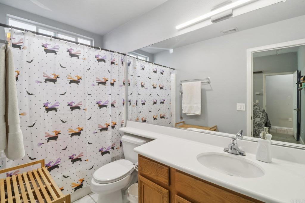 232 Manzanilla Way Oceanside, CA 92057 - Photo 27 of 35 a bathroom with a sink toilet and shower