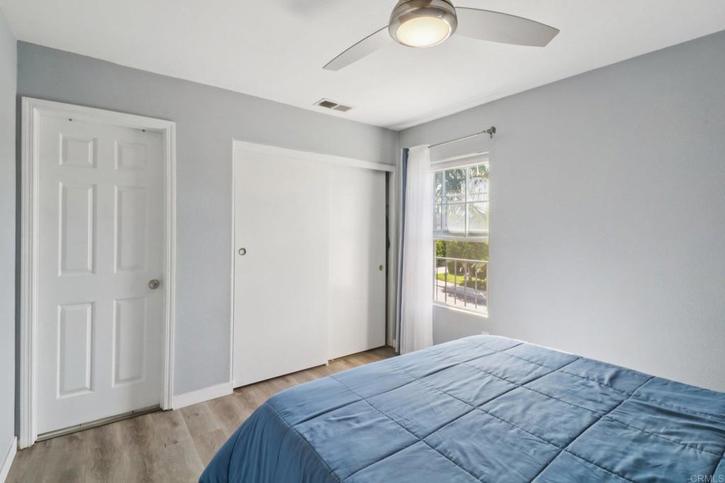 232 Manzanilla Way Oceanside, CA 92057 - Photo 30 of 35 a bedroom with a bed and a window