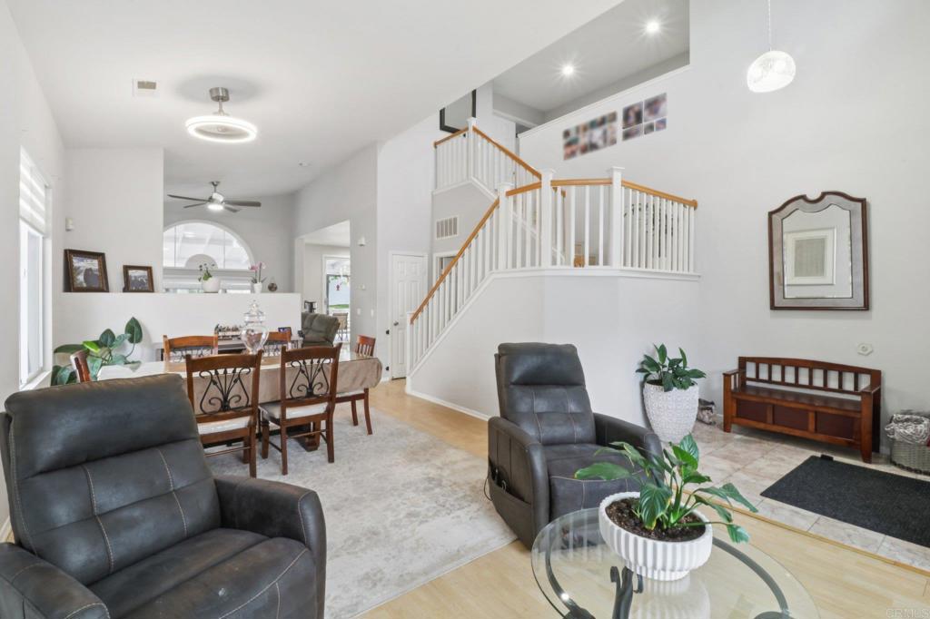 232 Manzanilla Way Oceanside, CA 92057 - Photo 3 of 35 a living room with furniture and a potted plant