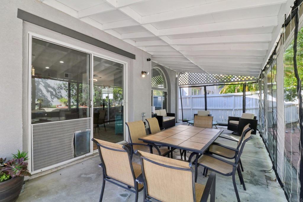 232 Manzanilla Way Oceanside, CA 92057 - Photo 35 of 35 a view of a dining room with furniture wooden floor and a potted plant