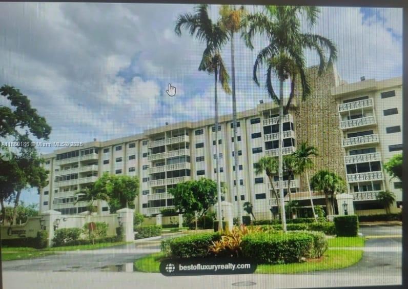 800 Northeast 195th Street, Unit 215 Miami, FL 33179 - Photo 2 of 11 a front view of a building