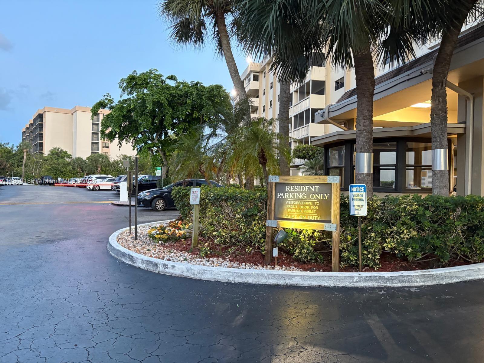800 Northeast 195th Street, Unit 215 Miami, FL 33179 - Photo 4 of 11 a front view of multiple houses with yard