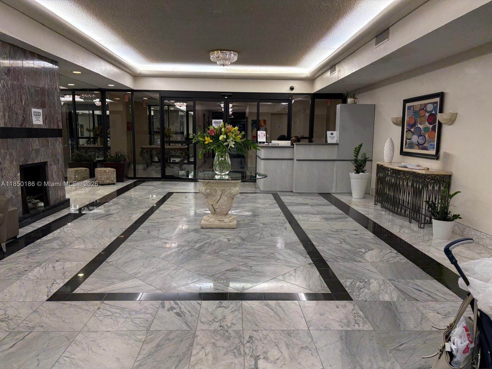 800 Northeast 195th Street, Unit 215 Miami, FL 33179 - Photo 5 of 11 a view of living room with furniture and window