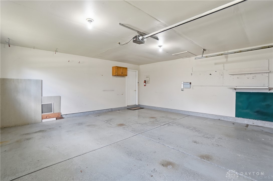 9964 Hummingbird Way Dayton, OH 45458 - Photo 28 of 57 This spacious garage offers ample room and direct interior access for convenience.