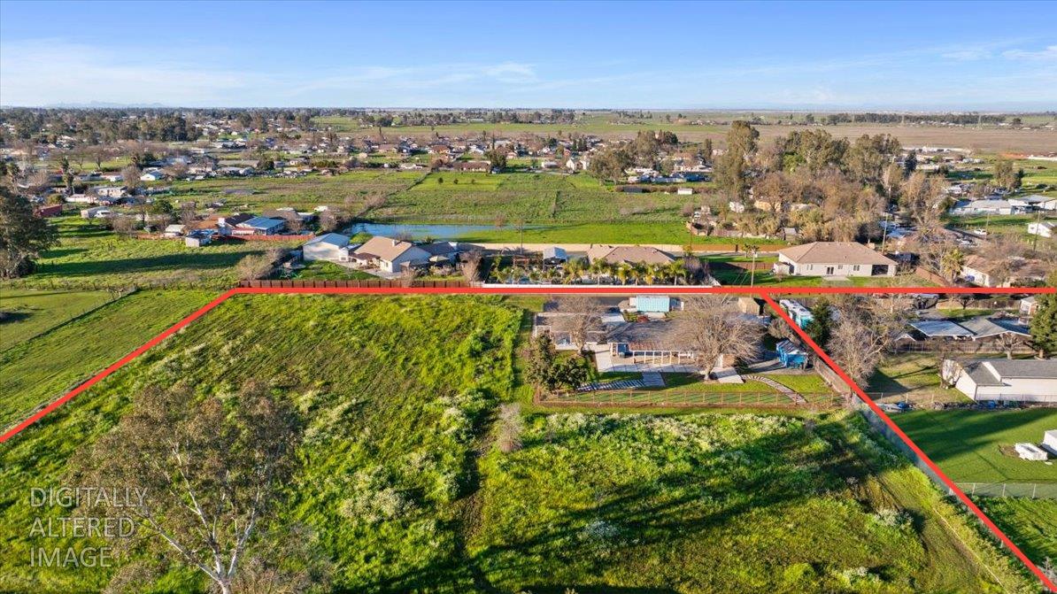 7261 Dry Creek Road Rio Linda, CA 95673 - Photo 1 of 59 an aerial view of a city with lots of residential buildings ocean and mountain view in back