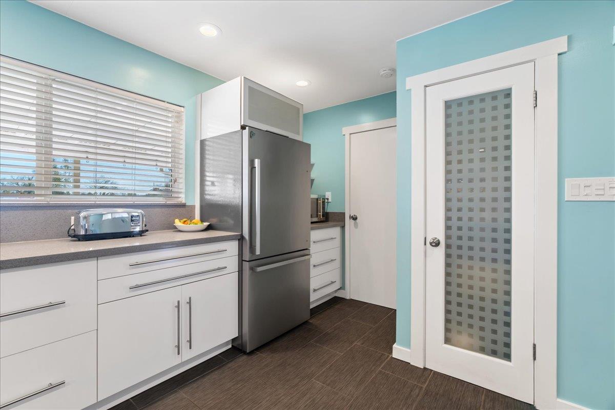 7261 Dry Creek Road Rio Linda, CA 95673 - Photo 11 of 59 a kitchen with stainless steel appliances a refrigerator and a sink